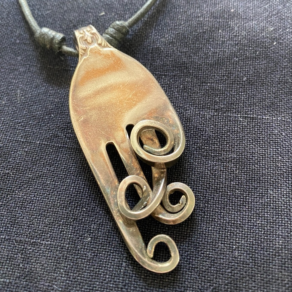 Artisan crafted silver fork necklace.